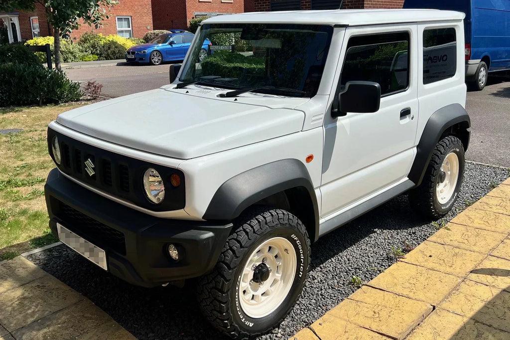 White Suzuki Jimny (2018+) with Vintage White High Peak J-01 wheels and BF Goodrich KO3 tyres